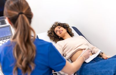 Professional Female Doctor Performing, Ultrasound Scan
