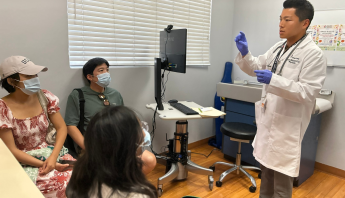 Kheir Pediatrician, Dr.Kang, with patient.