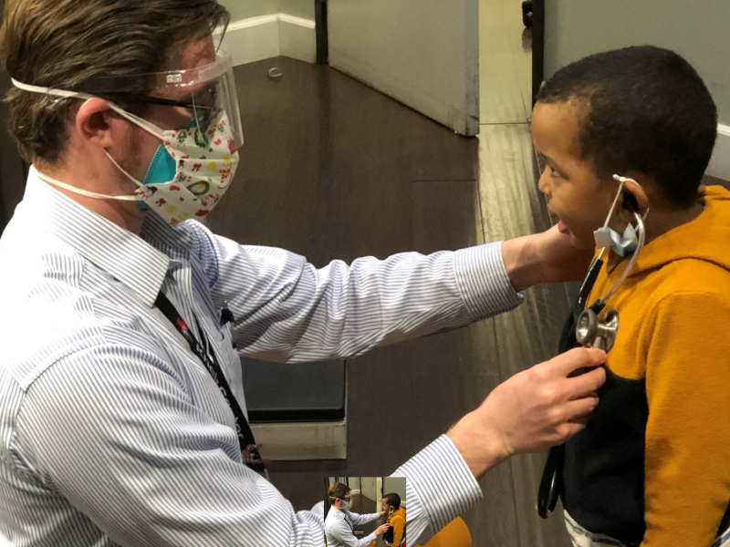 Medical Director providing care to pediatric patient.