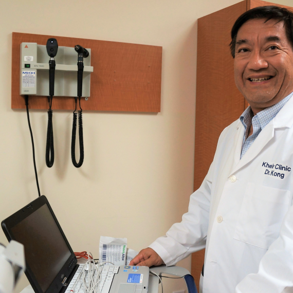 Dr. Kong meets with a patient through a telehealth video visit, providing care and answering questions.